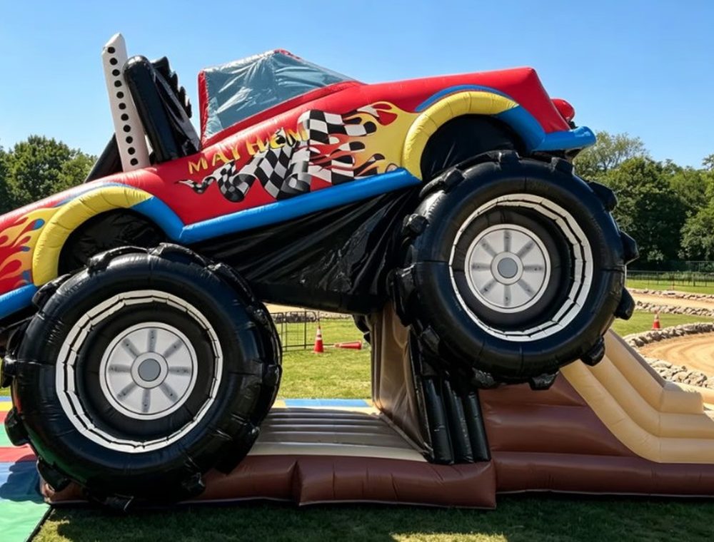 Red monster truck inflatable bouncy castle at Elysium Gardens. Saturdays only.